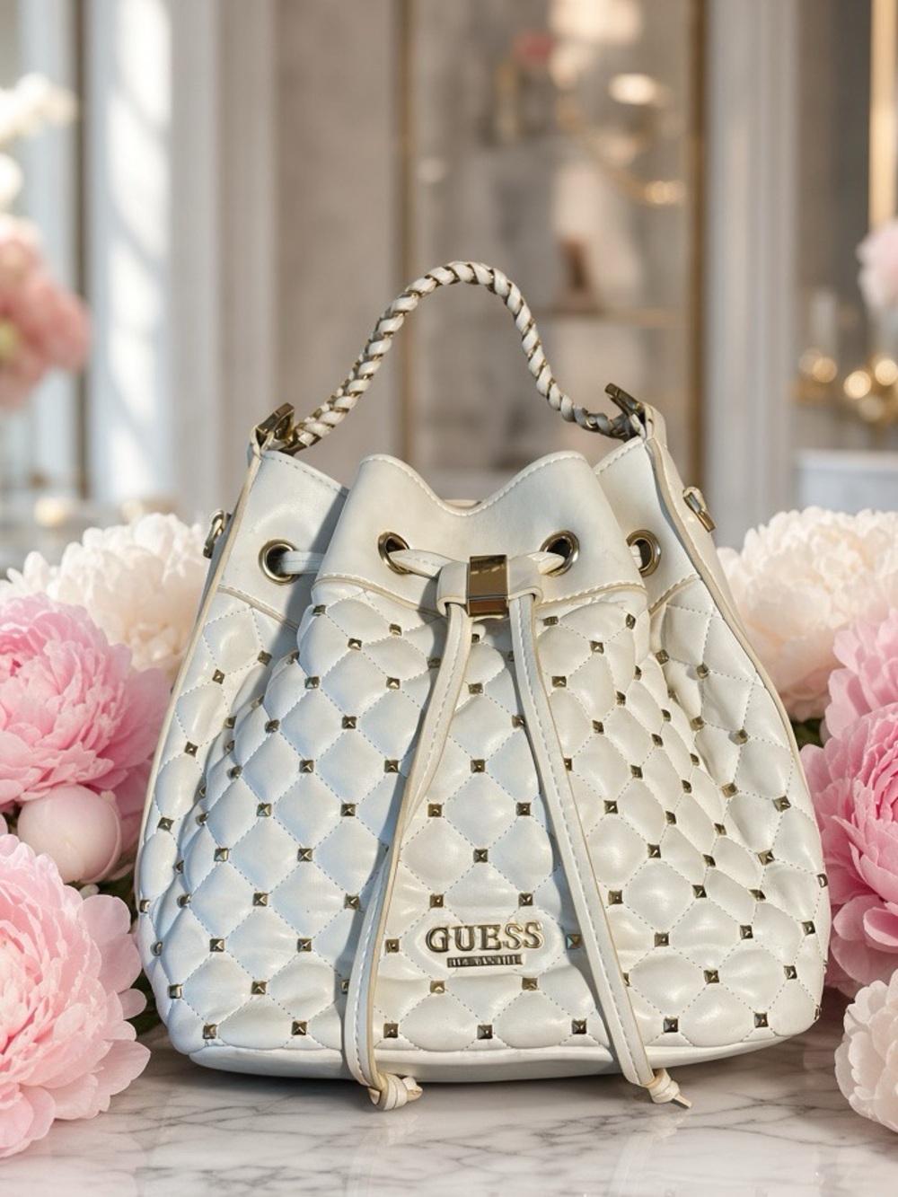 GUESS Cream Quilted Drawstring Bucket Bag with Gold Studs